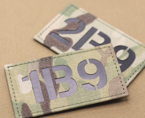 Infrared reflective callsign number patches on multicam background